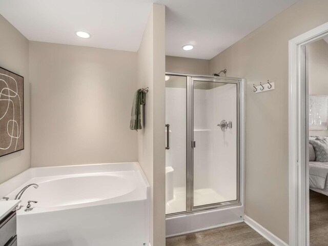 3031 Joseph Dr, Spring Hill, TN 37174 - bathroom with a bath, a stall shower, ensuite bath, vanity, and wood finished floors