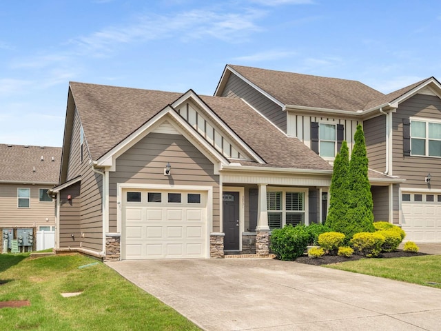 3031 Joseph Dr, Spring Hill, TN 37174 - craftsman inspired home with driveway, a shingled roof, stone siding, a garage, and a front yard