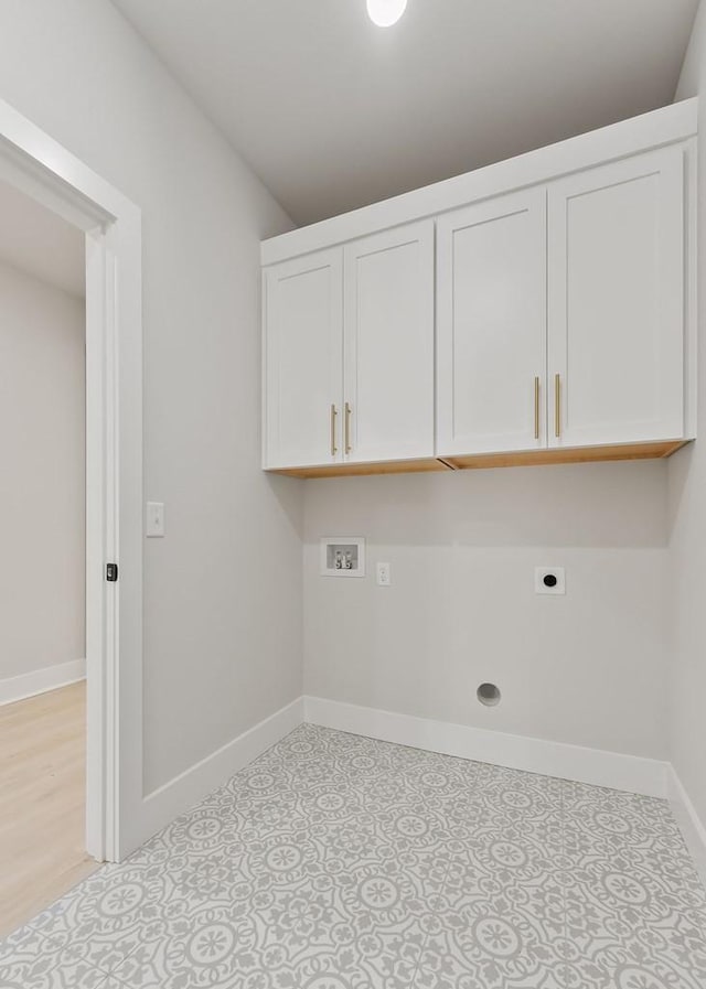 363 S Walnut Ave, Cookeville, TN 38501 - washroom featuring electric dryer hookup, baseboards, washer hookup, and cabinet space