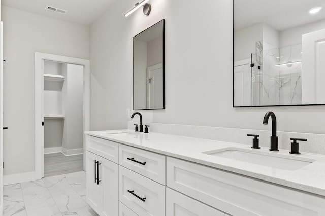 363 S Walnut Ave, Cookeville, TN 38501 - bathroom featuring marble look tiles, a marble finish shower, double vanity, baseboards, and recessed lighting