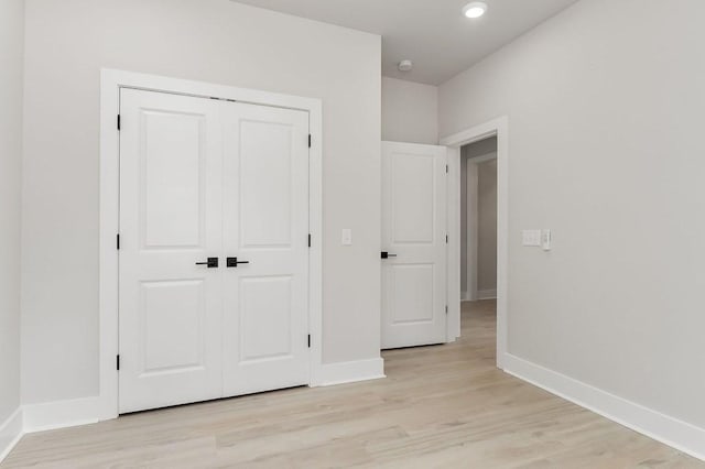 363 S Walnut Ave, Cookeville, TN 38501 - unfurnished bedroom with light wood finished floors, a closet, baseboards, and recessed lighting