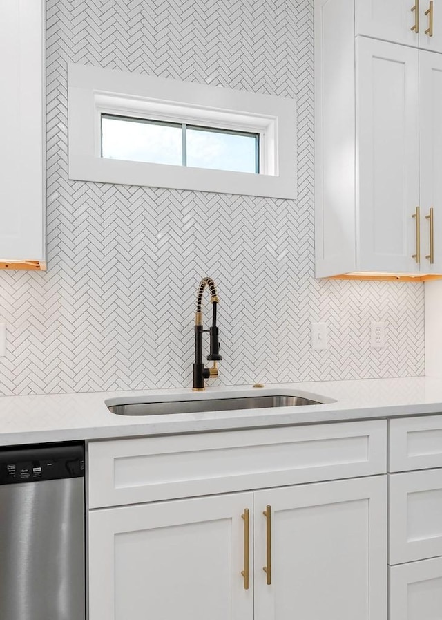 363 S Walnut Ave, Cookeville, TN 38501 - kitchen featuring dishwasher, a sink, light countertops, and white cabinets