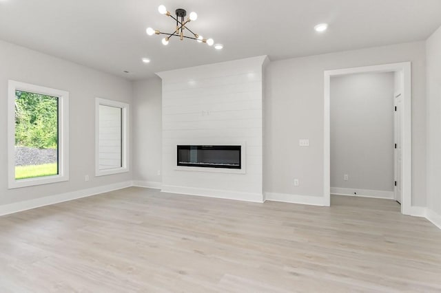 363 S Walnut Ave, Cookeville, TN 38501 - unfurnished living room with a chandelier, light wood finished floors, a large fireplace, baseboards, and recessed lighting
