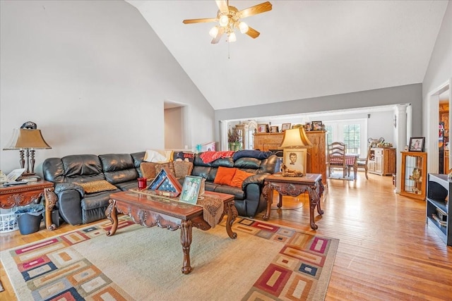 431 Jack Thomas Dr, Manchester, TN 37355 - living room featuring a ceiling fan, high vaulted ceiling, light wood-style flooring, and decorative columns