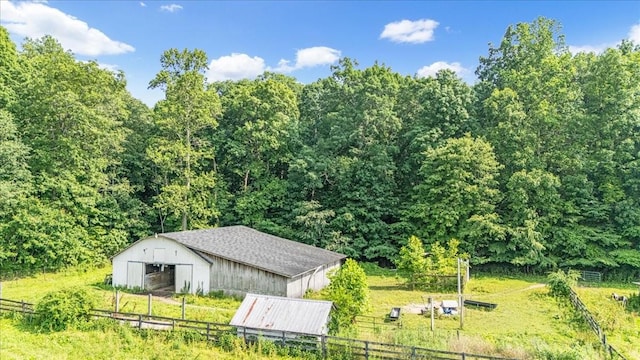 431 Jack Thomas Dr, Manchester, TN 37355 - view of pole building with a forest view