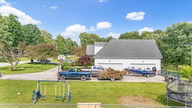 431 Jack Thomas Dr, Manchester, TN 37355 - rear view of house featuring a playground and roof with shingles