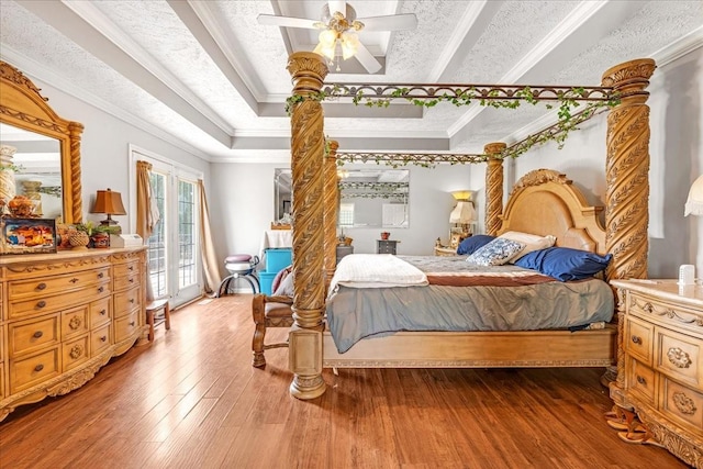 431 Jack Thomas Dr, Manchester, TN 37355 - bedroom with access to exterior, a tray ceiling, hardwood / wood-style flooring, ornamental molding, and a ceiling fan