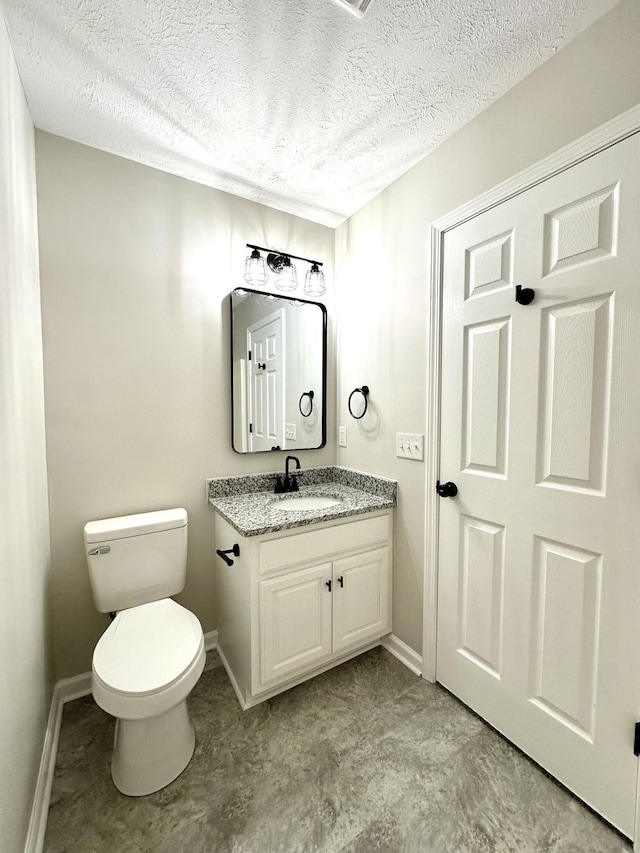 115 Briley Ln, Portland, TN 37148 - bathroom with a textured ceiling, toilet, vanity, and baseboards