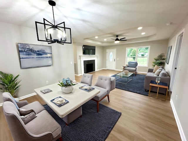 115 Briley Ln, Portland, TN 37148 - living area featuring light wood-type flooring, a tray ceiling, baseboards, recessed lighting, and ceiling fan