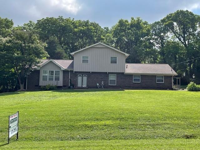 1002 Sunny Hill Rd, Brentwood, TN 37027 - view of front facade featuring a front lawn and brick siding