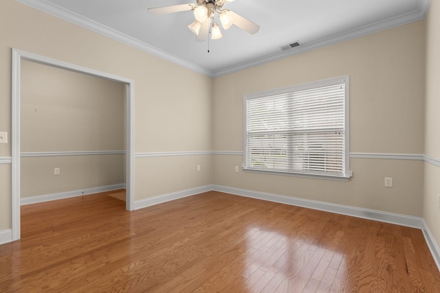 226 Wrennewood Ln, Franklin, TN 37064 - empty room with wood finished floors, ceiling fan, crown molding, and baseboards