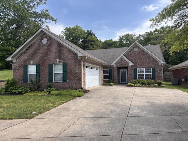 226 Wrennewood Ln, Franklin, TN 37064 - single story home with driveway, brick siding, central AC, an attached garage, and a front lawn