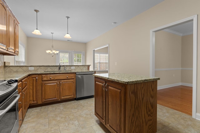 226 Wrennewood Ln, Franklin, TN 37064 - kitchen with appliances with stainless steel finishes, a sink, decorative backsplash, and a chandelier