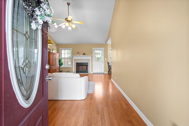 3700 Wheatfield Ln, Clarksville, TN 37040 - entryway with light wood-type flooring, a ceiling fan, lofted ceiling, baseboards, and a fireplace