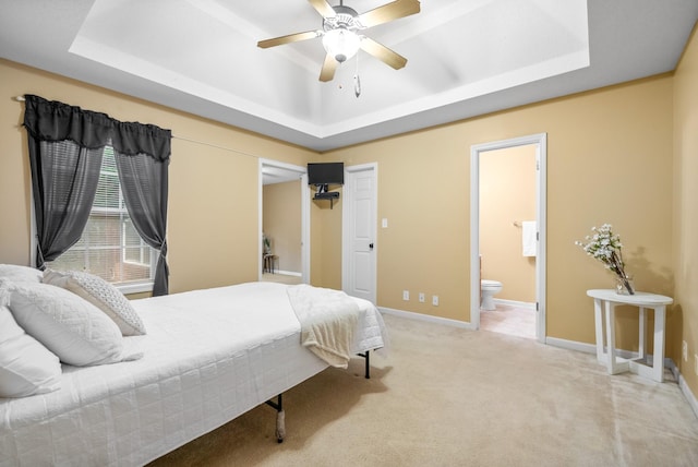 3700 Wheatfield Ln, Clarksville, TN 37040 - bedroom with a raised ceiling, light colored carpet, ensuite bath, and baseboards
