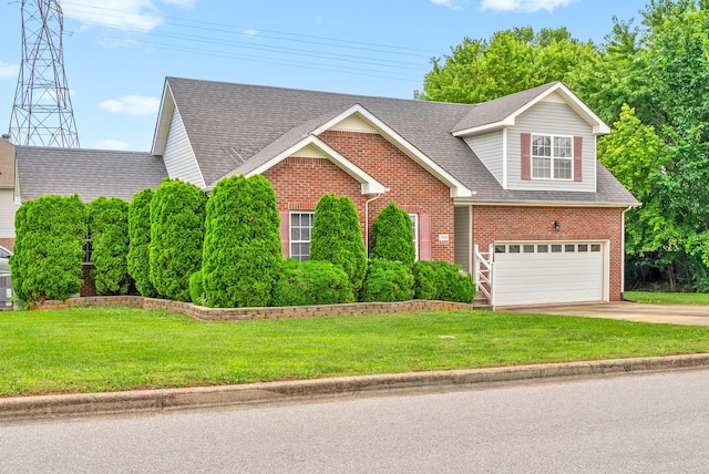 3700 Wheatfield Ln, Clarksville, TN 37040 - view of front of property featuring brick siding, a garage, concrete driveway, and a front yard
