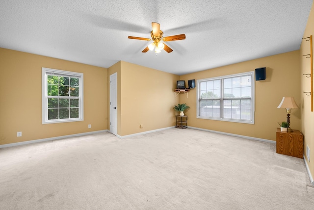3700 Wheatfield Ln, Clarksville, TN 37040 - spare room featuring ceiling fan, carpet flooring, a textured ceiling, and baseboards