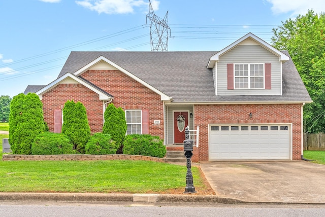 3700 Wheatfield Ln, Clarksville, TN 37040 - traditional-style house with a front lawn, brick siding, concrete driveway, a garage, and roof with shingles