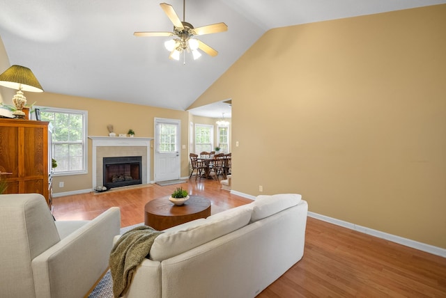 3700 Wheatfield Ln, Clarksville, TN 37040 - living room featuring light wood-type flooring, high vaulted ceiling, baseboards, ceiling fan, and a fireplace