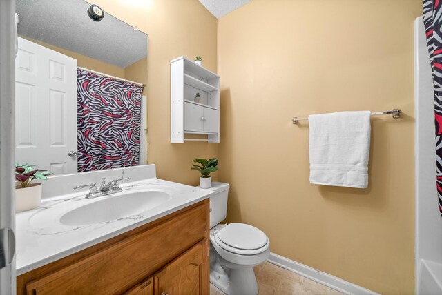 3700 Wheatfield Ln, Clarksville, TN 37040 - full bath with vanity, toilet, baseboards, tile patterned floors, and a shower with shower curtain
