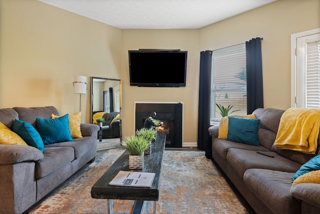 1515 Bridgecrest Dr Unit 220, Antioch, TN 37013 - living room with healthy amount of natural light, a fireplace with flush hearth, and wood finished floors