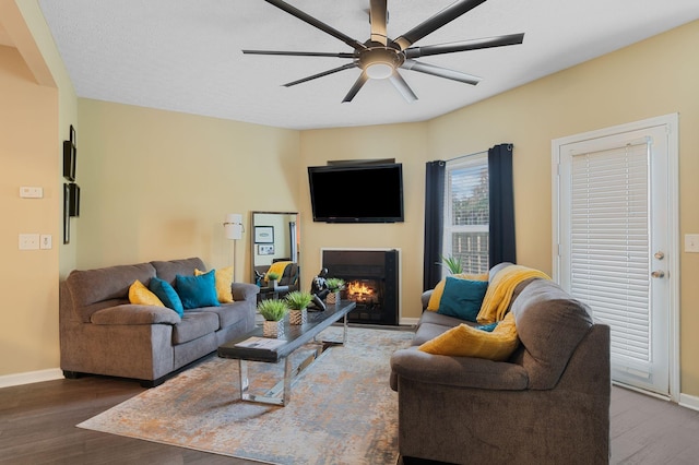 1515 Bridgecrest Dr Unit 220, Antioch, TN 37013 - living room with wood finished floors, a lit fireplace, ceiling fan, and baseboards