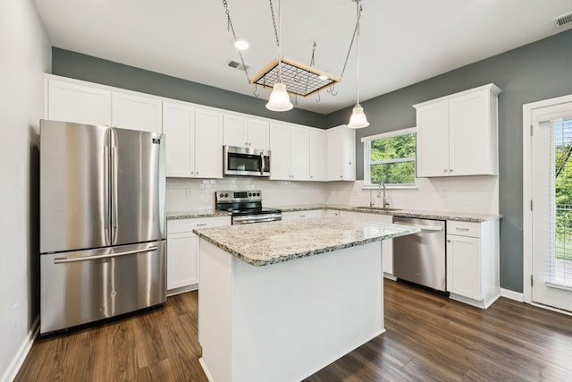 3211 Briar Chapel Dr, Murfreesboro, TN 37128 - kitchen featuring appliances with stainless steel finishes, a sink, dark wood-style flooring, white cabinetry, and backsplash