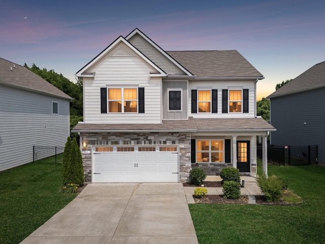 3211 Briar Chapel Dr, Murfreesboro, TN 37128 - view of front of house with driveway, stone siding, a garage, and a shingled roof