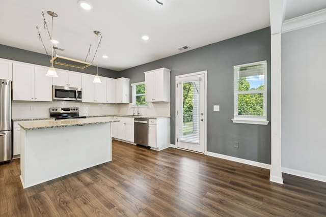 3211 Briar Chapel Dr, Murfreesboro, TN 37128 - kitchen with appliances with stainless steel finishes, a sink, dark wood-style flooring, white cabinets, and recessed lighting