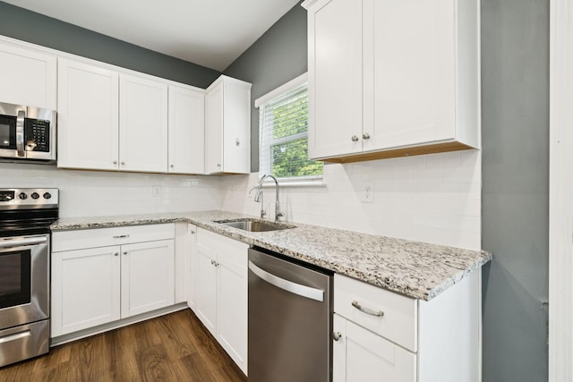 3211 Briar Chapel Dr, Murfreesboro, TN 37128 - kitchen featuring stainless steel appliances, a sink, dark wood-style flooring, light stone countertops, and white cabinets