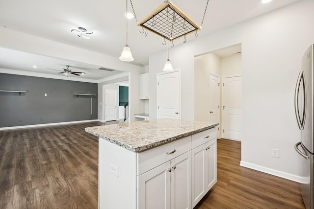 3211 Briar Chapel Dr, Murfreesboro, TN 37128 - kitchen with freestanding refrigerator, ceiling fan, dark wood-type flooring, baseboards, and white cabinets