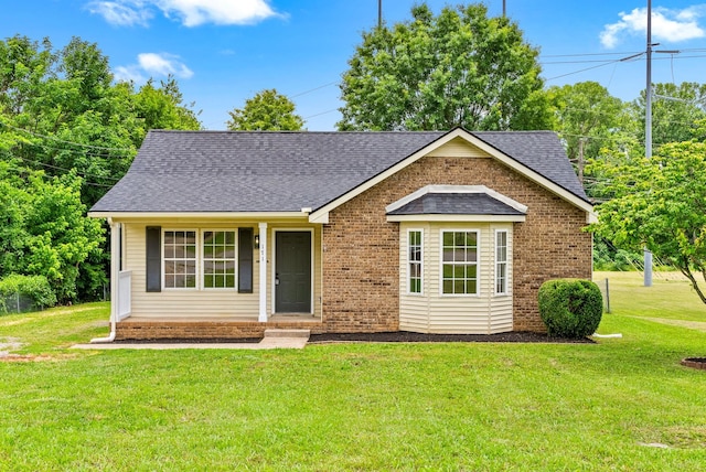 171 Stephanie Dr, Clarksville, TN 37042 - view of front of home with a front yard, roof with shingles, and brick siding
