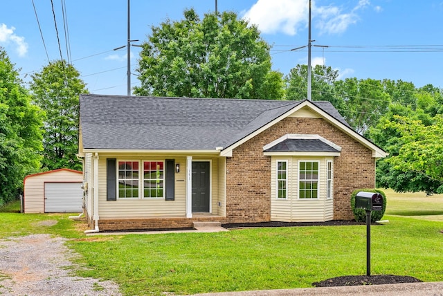 171 Stephanie Dr, Clarksville, TN 37042 - ranch-style house featuring a front yard, a garage, driveway, roof with shingles, and brick siding