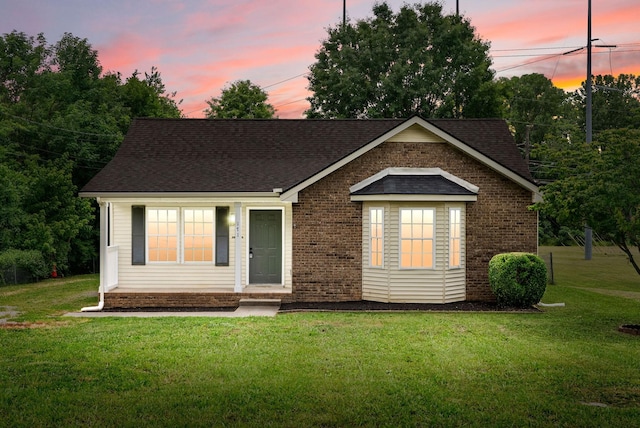 171 Stephanie Dr, Clarksville, TN 37042 - view of front of property with a front lawn, roof with shingles, and brick siding