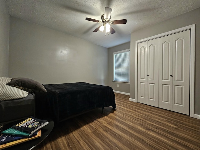 2524 Distillery Rd, Greenbrier, TN 37073 - bedroom with wood finished floors, baseboards, a closet, a textured ceiling, and ceiling fan
