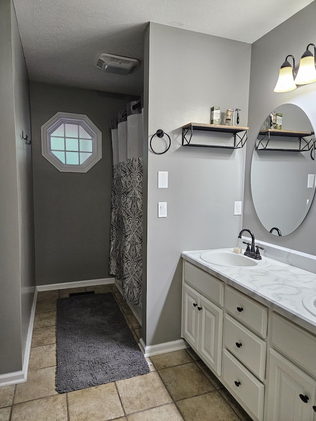 2524 Distillery Rd, Greenbrier, TN 37073 - bathroom featuring vanity, baseboards, a shower with shower curtain, and a textured ceiling