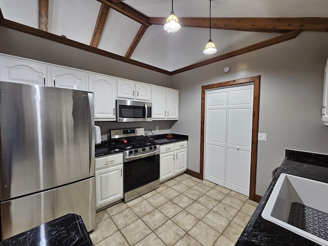 2524 Distillery Rd, Greenbrier, TN 37073 - kitchen with stainless steel appliances, white cabinetry, dark countertops, light tile patterned flooring, and hanging light fixtures