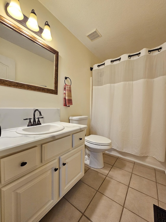 2524 Distillery Rd, Greenbrier, TN 37073 - bathroom with tile patterned flooring, vanity, toilet, shower / bath combo with shower curtain, and a textured ceiling