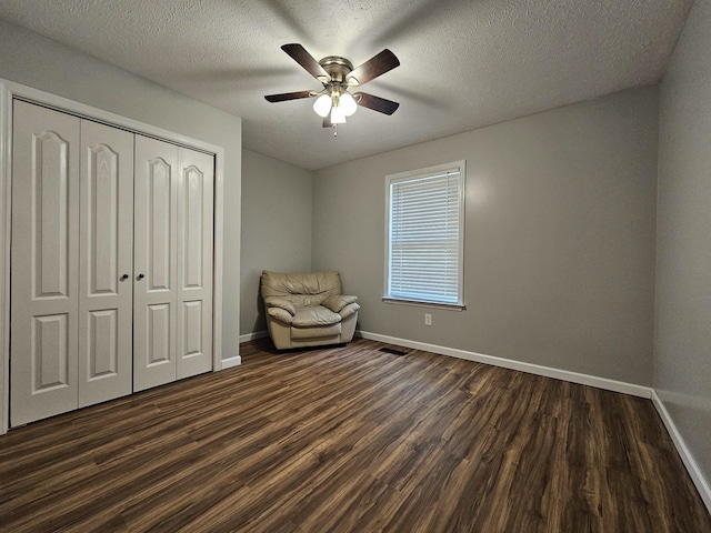 2524 Distillery Rd, Greenbrier, TN 37073 - sitting room with dark wood-style floors, baseboards, ceiling fan, and a textured ceiling