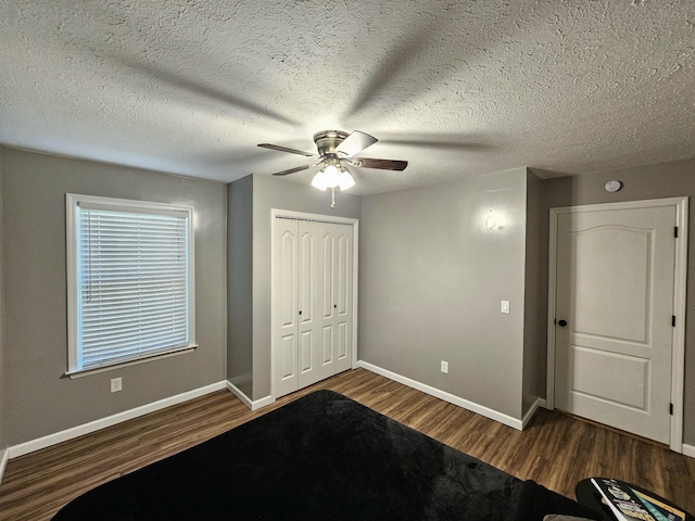 2524 Distillery Rd, Greenbrier, TN 37073 - unfurnished bedroom with wood finished floors, baseboards, a closet, and a ceiling fan