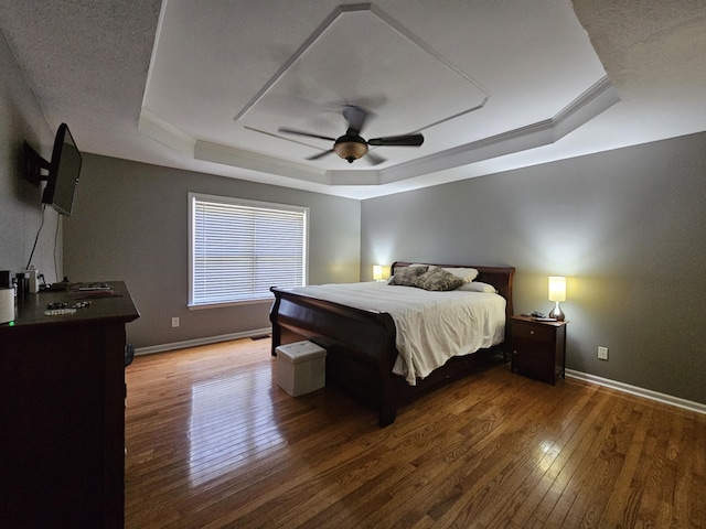 2524 Distillery Rd, Greenbrier, TN 37073 - bedroom featuring a tray ceiling, wood-type flooring, baseboards, ceiling fan, and crown molding