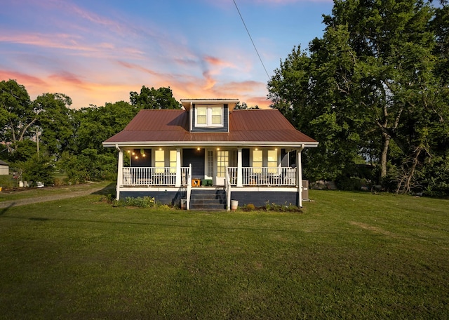 1812 Elizabeth Rd, Nashville, TN 37218 - bungalow-style house featuring a porch, a front lawn, and metal roof