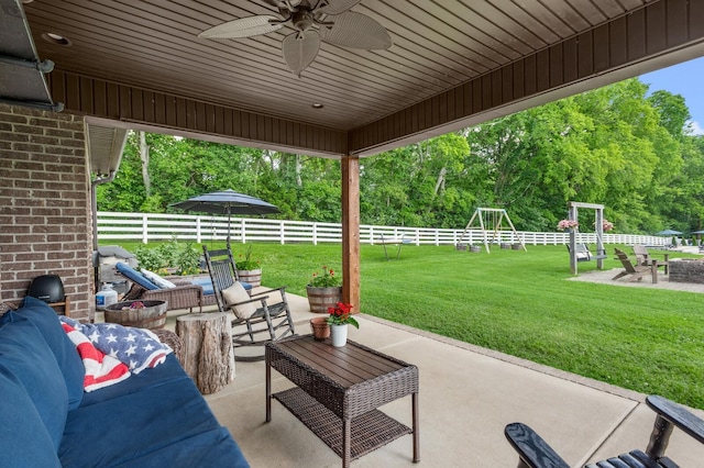 1705 Allisona Rd, Eagleville, TN 37060 - view of patio with an outdoor living space, a ceiling fan, and view of wooded area