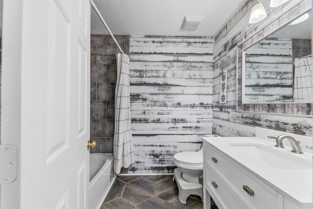 314 Millhouse Rd, Smyrna, TN 37167 - full bathroom with vanity, toilet, a textured ceiling, shower / bath combination with curtain, and wood walls