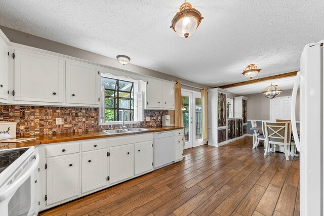 314 Millhouse Rd, Smyrna, TN 37167 - kitchen featuring a sink, white appliances, a textured ceiling, backsplash, and white cabinets