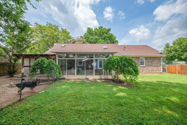 314 Millhouse Rd, Smyrna, TN 37167 - rear view of property with a sunroom, brick siding, and a garden