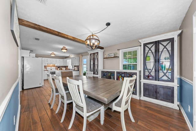 314 Millhouse Rd, Smyrna, TN 37167 - dining room featuring a chandelier, dark wood finished floors, baseboards, and a textured ceiling