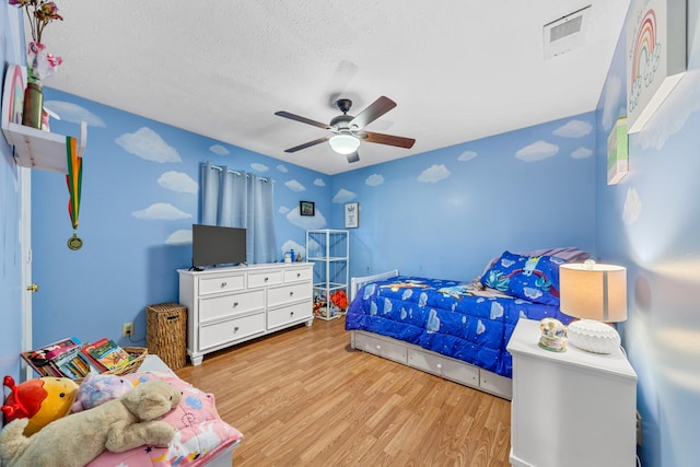 314 Millhouse Rd, Smyrna, TN 37167 - bedroom featuring wood finished floors, a ceiling fan, and a textured ceiling