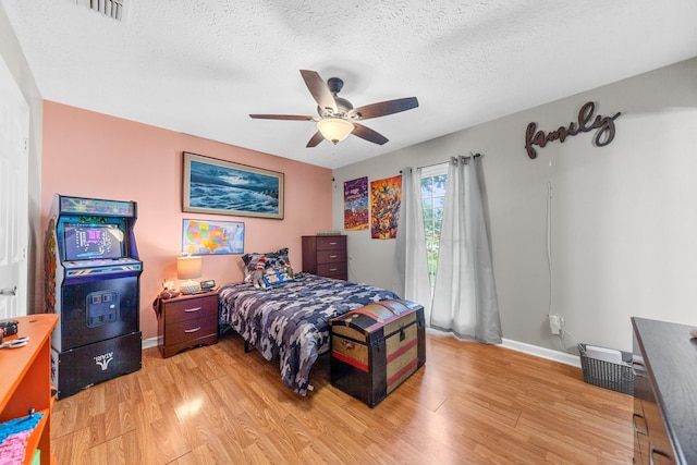 314 Millhouse Rd, Smyrna, TN 37167 - bedroom with light wood-style floors, baseboards, a textured ceiling, and ceiling fan
