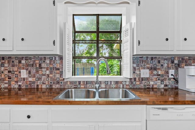 314 Millhouse Rd, Smyrna, TN 37167 - kitchen featuring a sink, dishwasher, decorative backsplash, and white cabinets